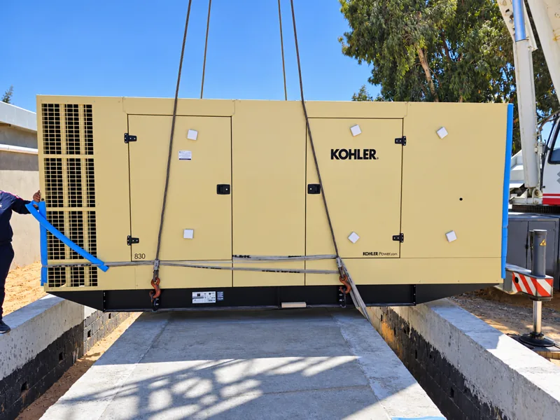 Lowering the generator onto its base
